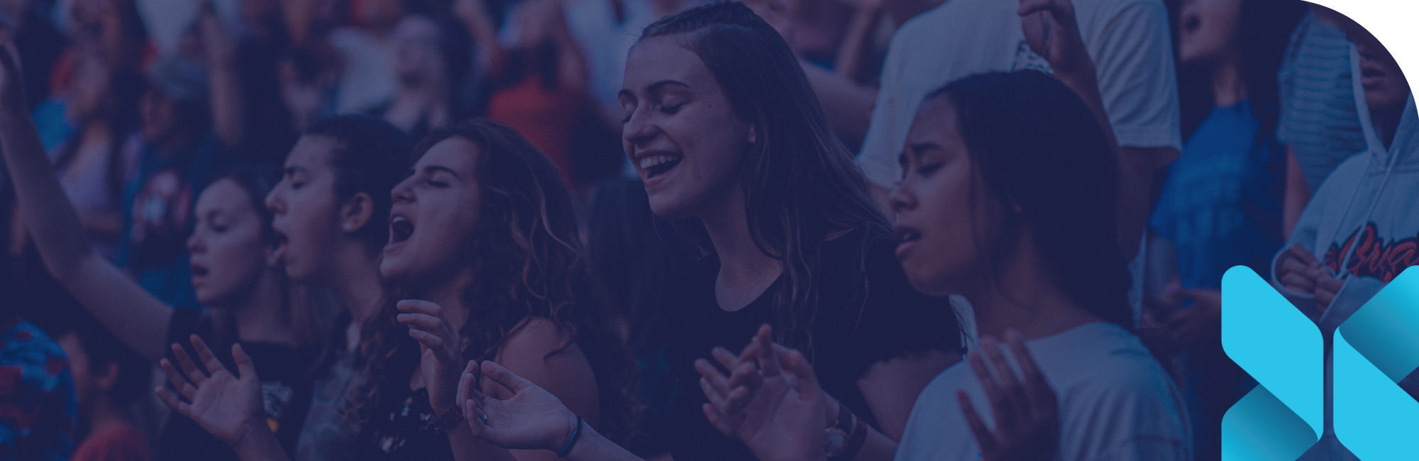 young girls praising Jesus during worship