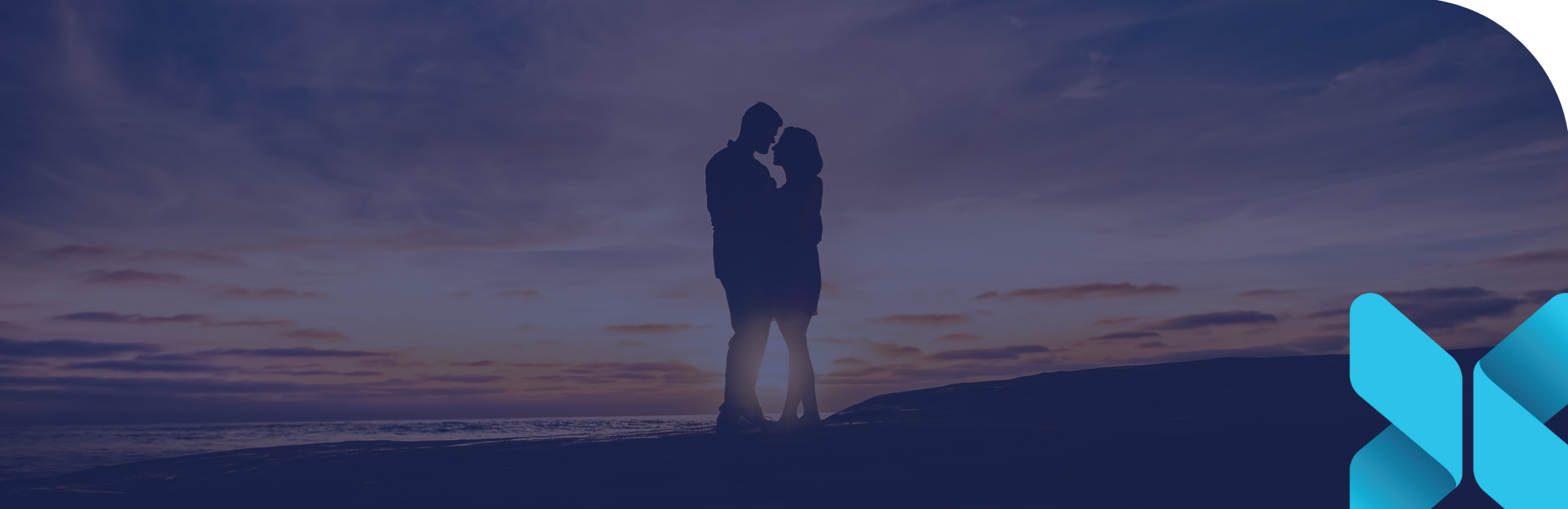 silhouette of a couple in-front of a sunet